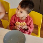 Child exploring food textures during pediatric feeding therapy